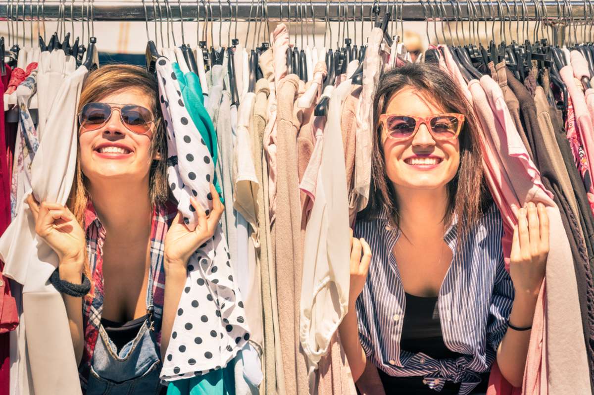 Young beautiful women at weekly cloth market