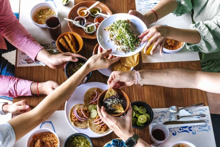 group of Friend eating Mexican Tacos and traditional food-1